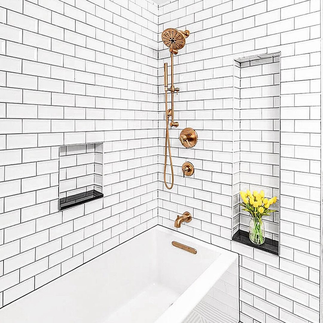 Off-set subway tile pattern in bathroom with black non-standard grout