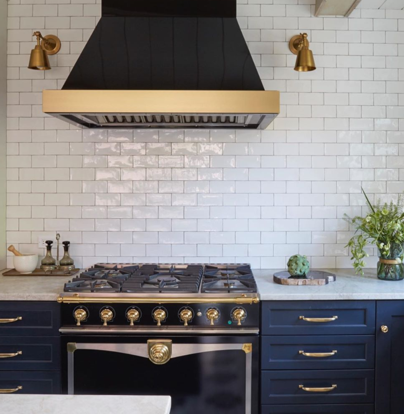 White subway tile used as kitchen wall backsplash with off white grout