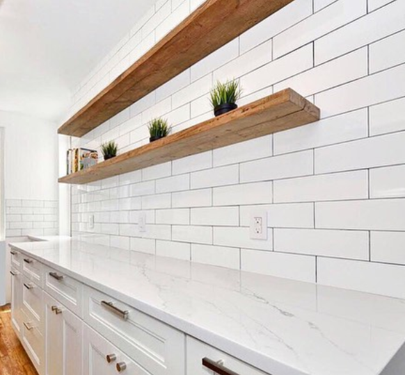 White subway tile used in utility room wall with black darker grout 