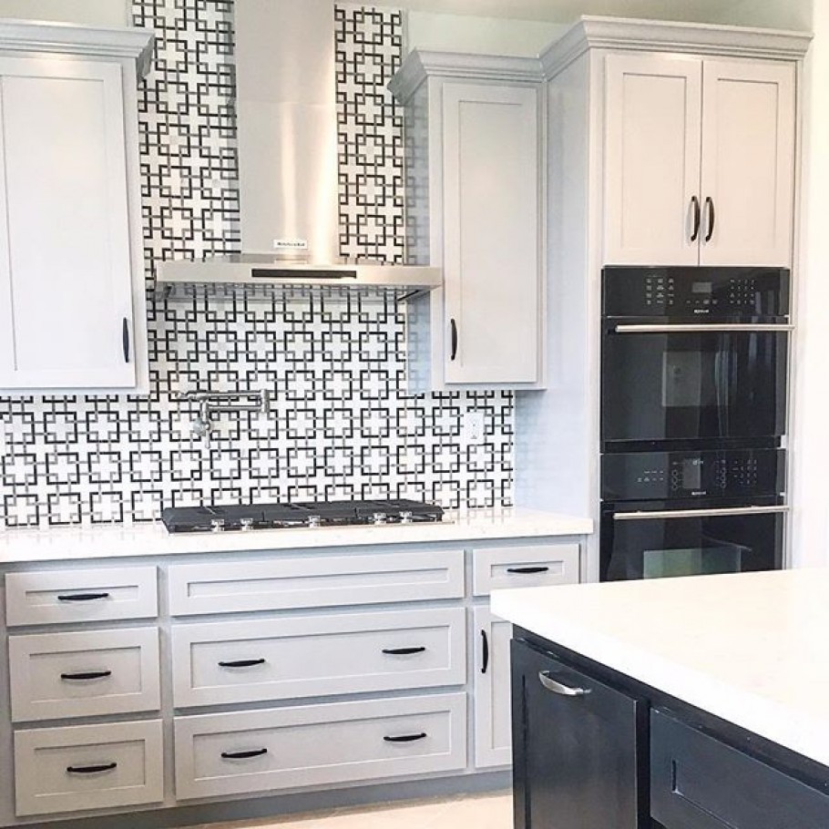 modern kitchen with geometric tile backsplash