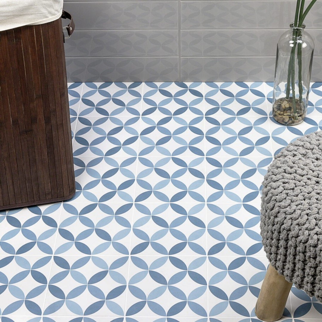 Blue patterned tile on floor with knitted stool