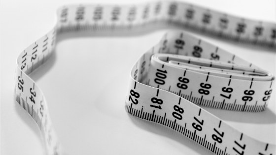 Image of a tape measure with white background 