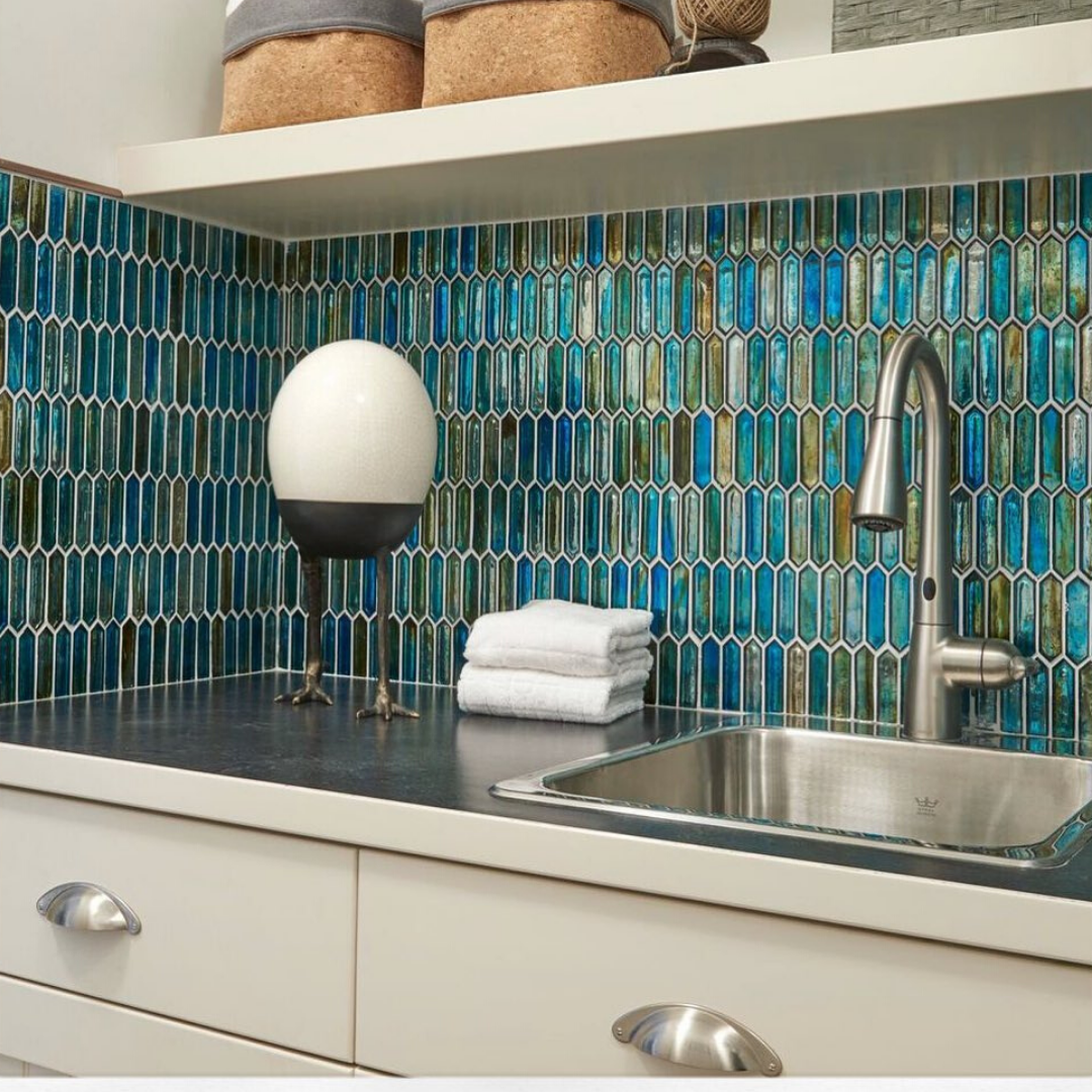 Komorebi Juneau Spring Glass Tile used in the kitchen above the work top counter and as a sink backsplash