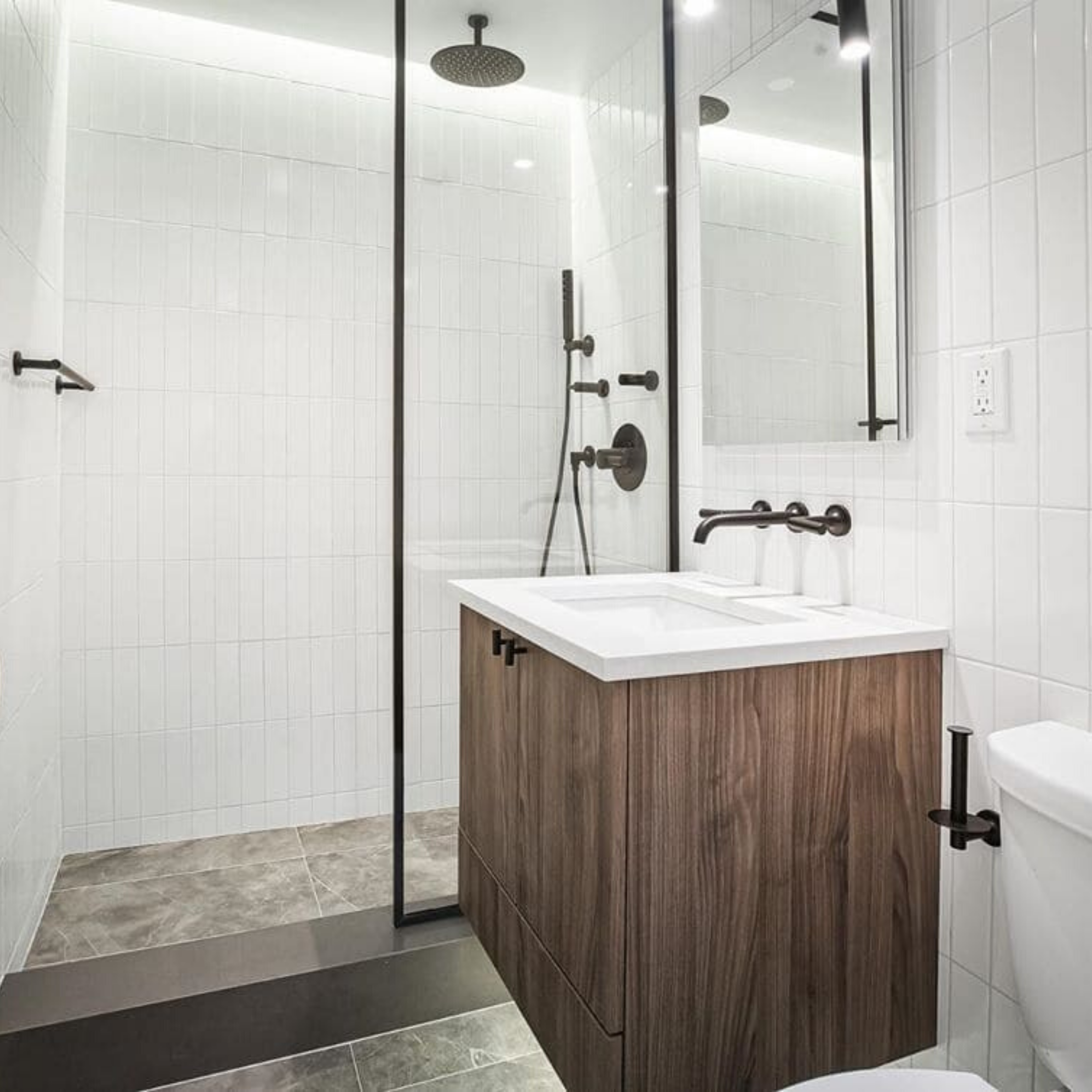 Classic white look subway tiles shown in the bathroom and shower laid vertically on the wall