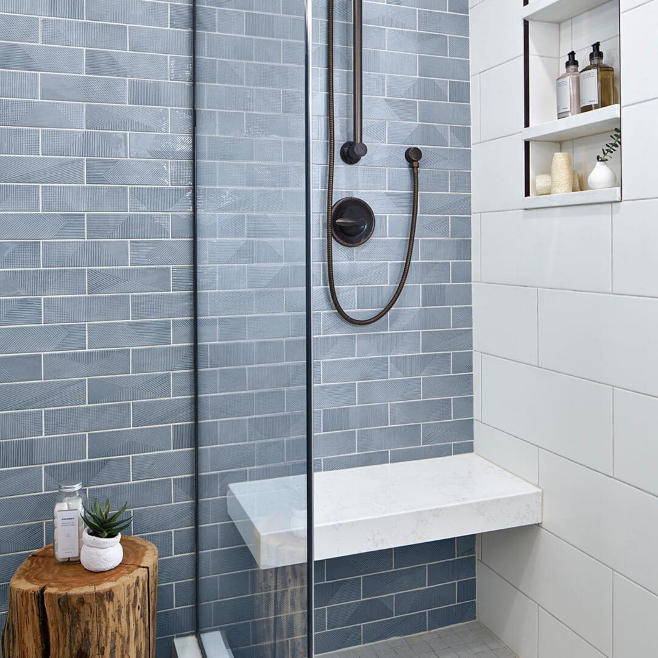 Enigma Ash Blue 2x8 Polished Ceramic Wall Tile. It's a textured tile used on the shower wall